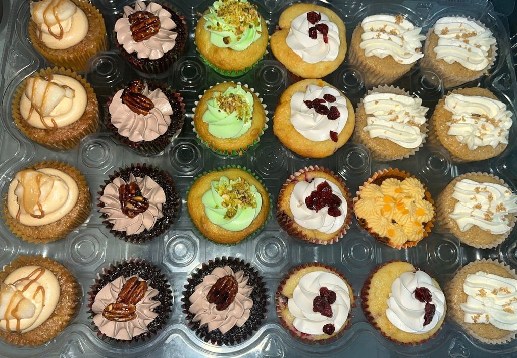 Assorted Cupcakes with Decorative Frosting and Toppings