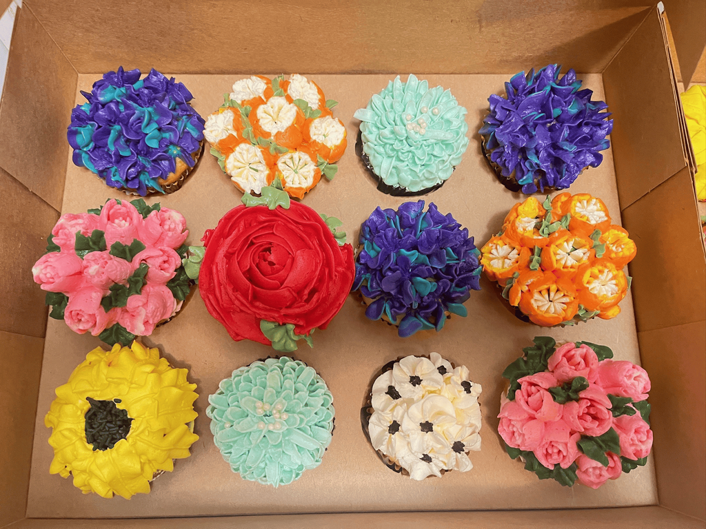 Assorted Flower-Themed Cupcakes with Colorful Buttercream Frosting