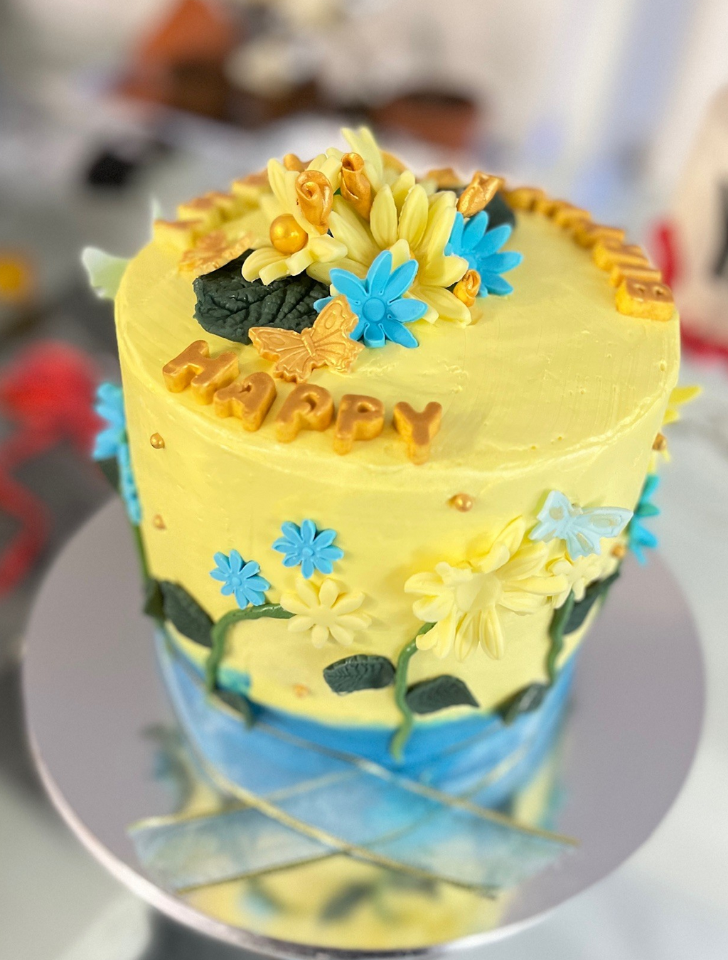 Yellow and Blue Flower Cake with Fondant Butterflies